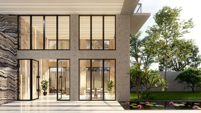 Modern house with floor-to-ceiling windows beside a garden