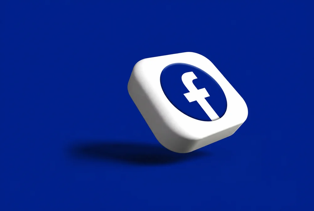 Three-dimensional Facebook icon on a navy background